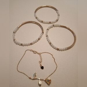 #690. 4 Piece Gold Toned, Faux Pearl And Rose Flower Bracelet Bundle